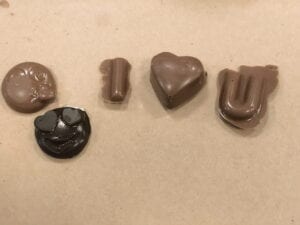 Some of our favorite chocolate molds--hearts, emojis and letters