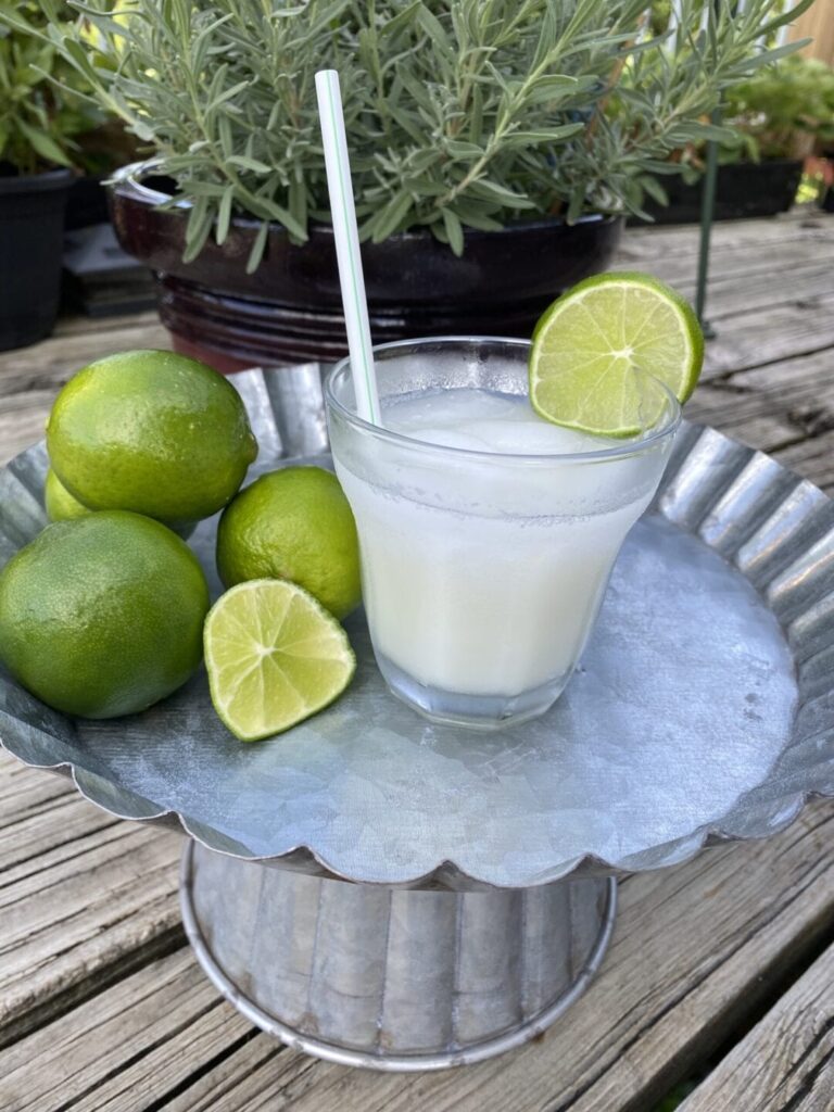 Brazilian lemonade with limes on table