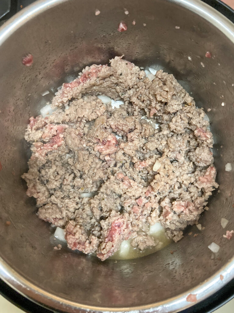 Instant Pot full of browning sausage