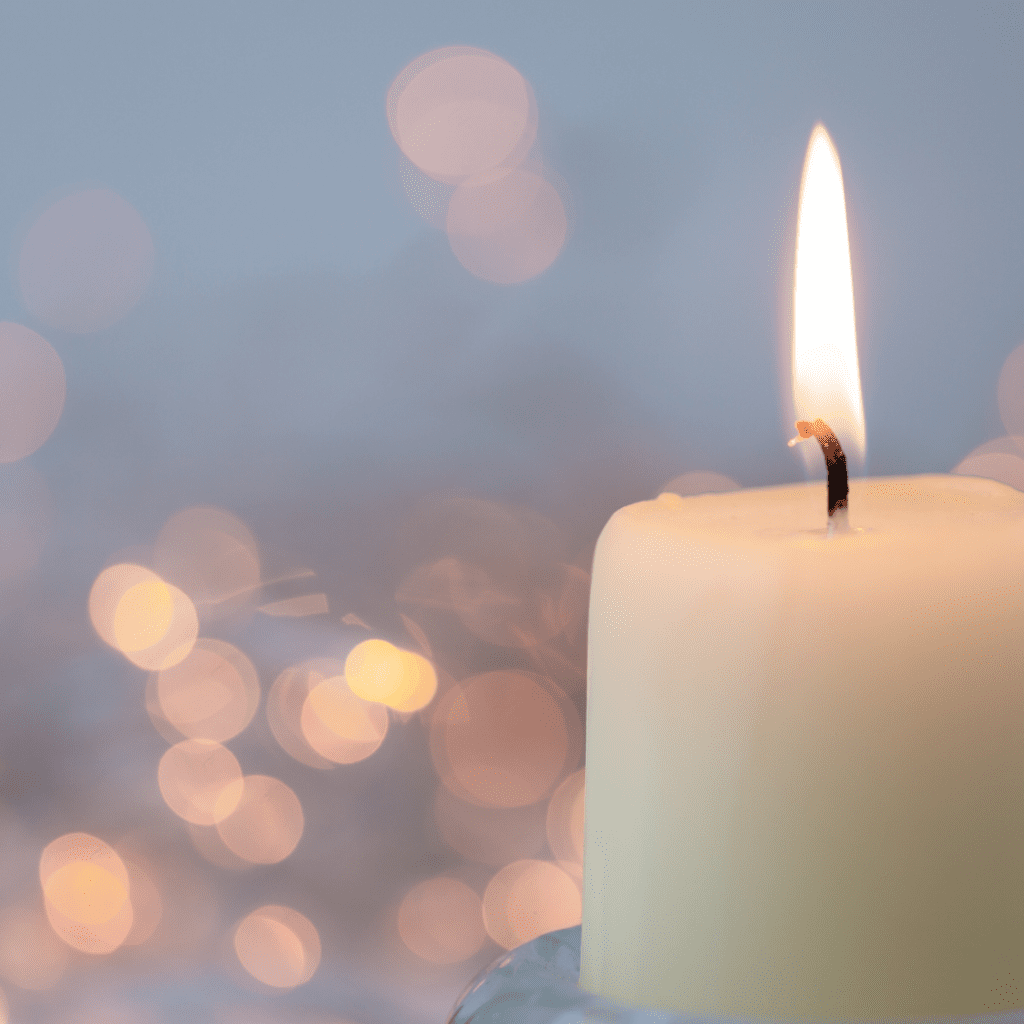 lit candle to remember babies after miscarriage